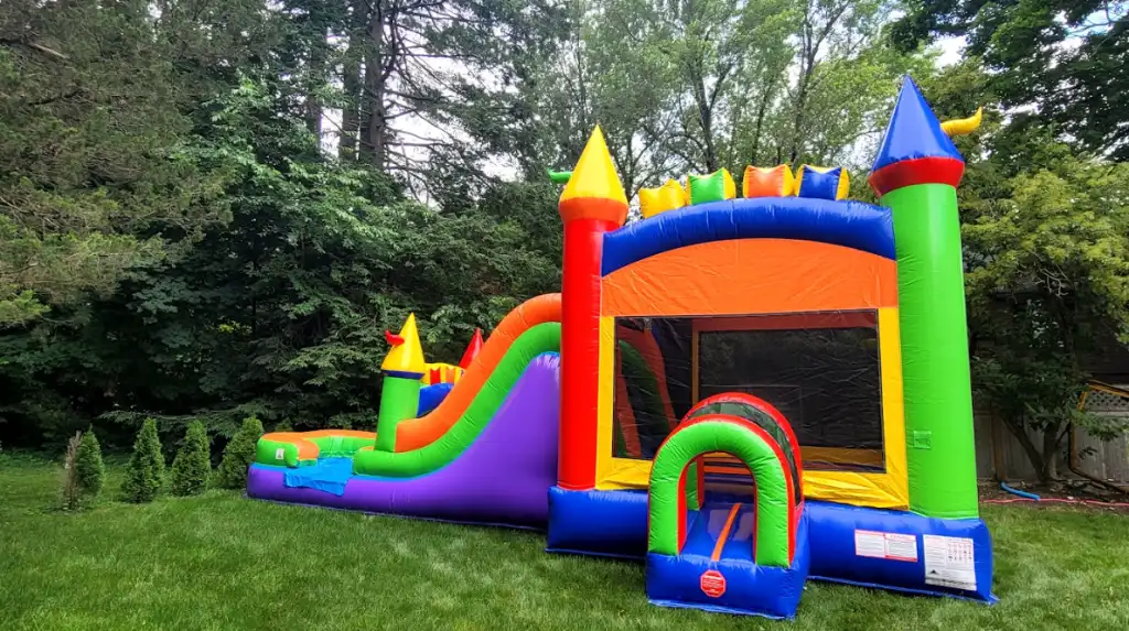 multi color bounce house outdoor set-up