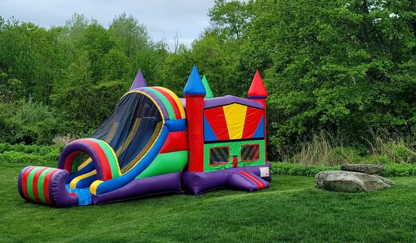 rainbow bounce house with slide outdoor set-up