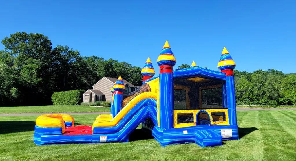 bounce house with slide rental in the sunny outdoors